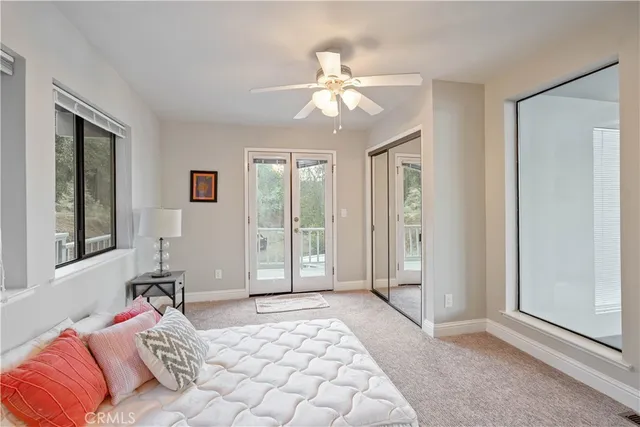 a view of a roof deck with table and chairs