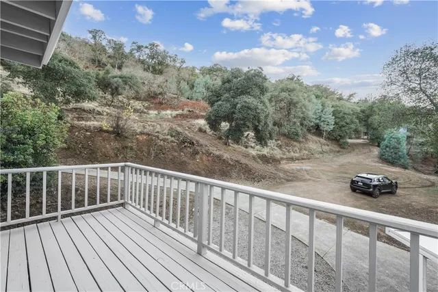 a view of a house with a yard and a garage