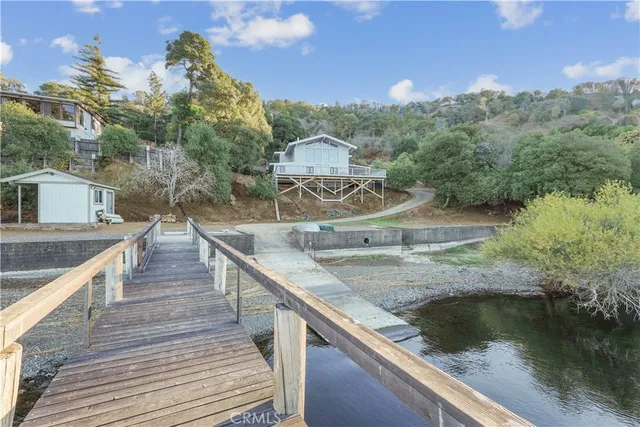 a swimming pool view with a lake view