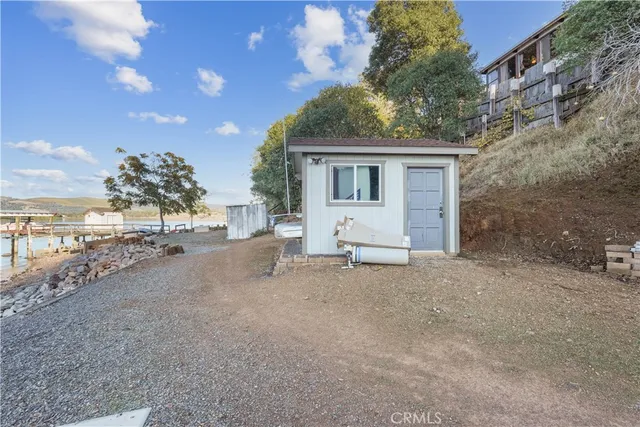 a view of a wooden deck front of house