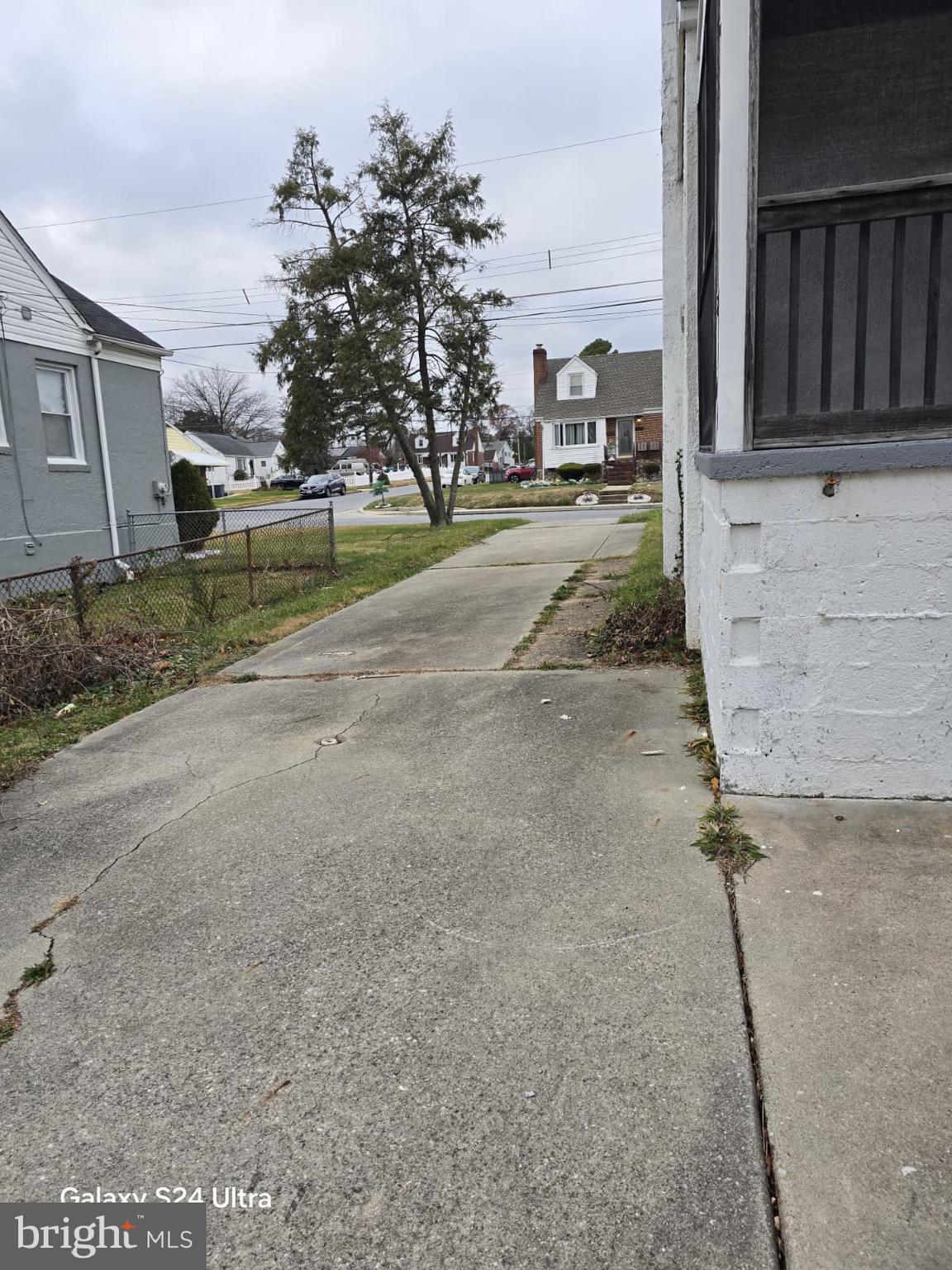 3303 Fairview Road Gwynn Oak, MD 21207 - Photo 12 of 12 a view of a street with cars parked