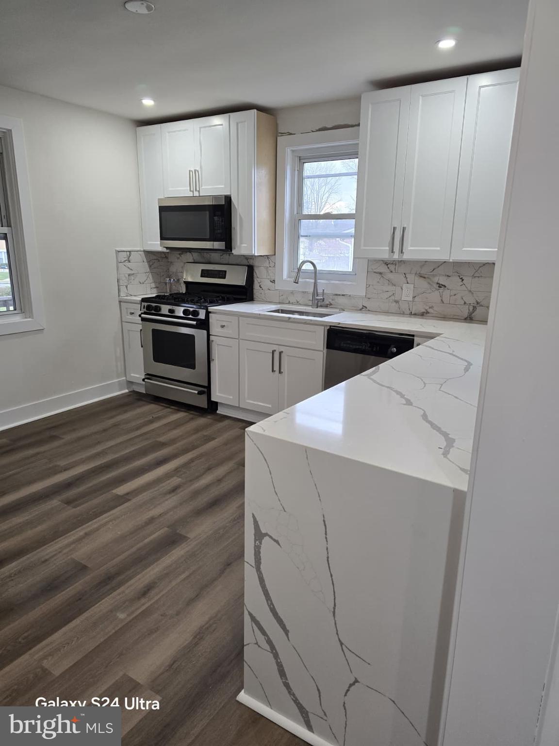 3303 Fairview Road Gwynn Oak, MD 21207 - Photo 3 of 12 a kitchen with a sink and a stove top oven