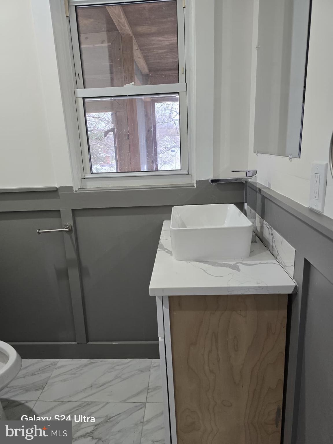 3303 Fairview Road Gwynn Oak, MD 21207 - Photo 10 of 12 a bathroom with a sink and a toilet