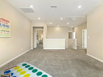 a bedroom with a bed and a night stand