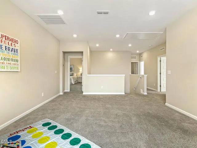 a bedroom with a bed and a night stand