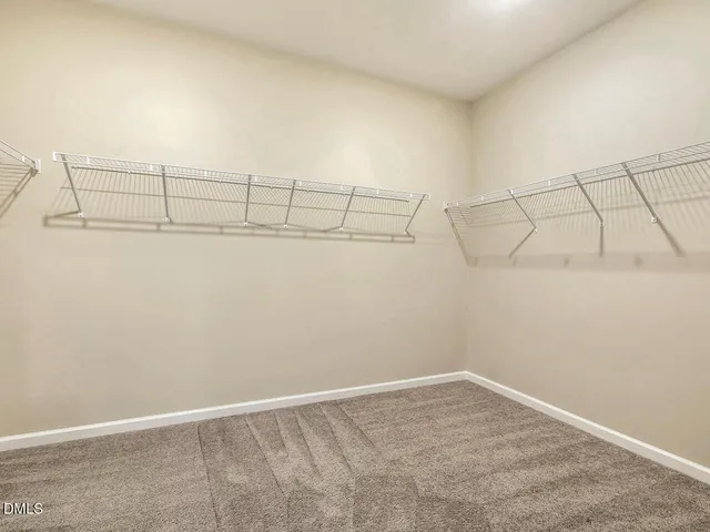 a bathroom with a toilet a sink and a mirror