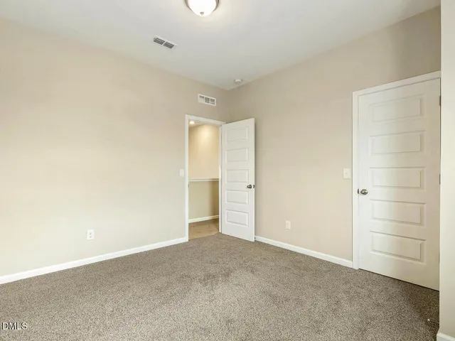 a view of a porch with furniture and a yard