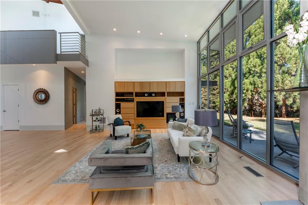 1775 Mt Paran Road Northwest Atlanta, GA 30327 - Photo 13 of 66 a living room with furniture and a fireplace