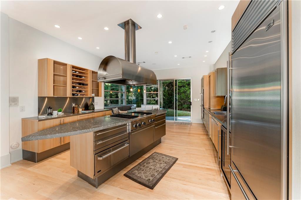 1775 Mt Paran Road Northwest Atlanta, GA 30327 - Photo 20 of 66 a kitchen with stainless steel appliances granite countertop a stove a sink and a refrigerator