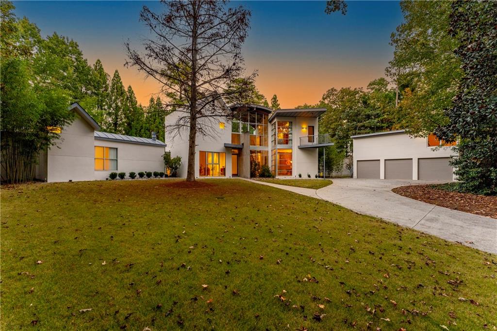 1775 Mt Paran Road Northwest Atlanta, GA 30327 - Photo 2 of 66 a front view of house with yard and trees