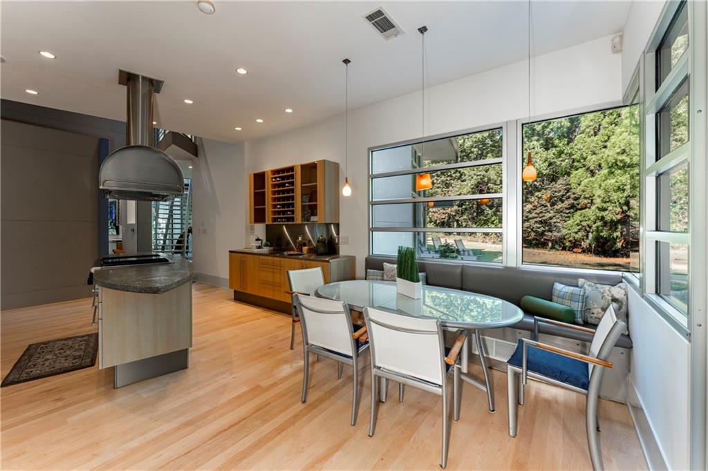 1775 Mt Paran Road Northwest Atlanta, GA 30327 - Photo 22 of 66 a view of a dining room with furniture window and wooden floor