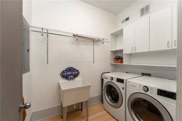 a bedroom with furniture and a flat screen tv
