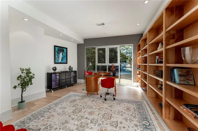 a room with a bed and a mirror