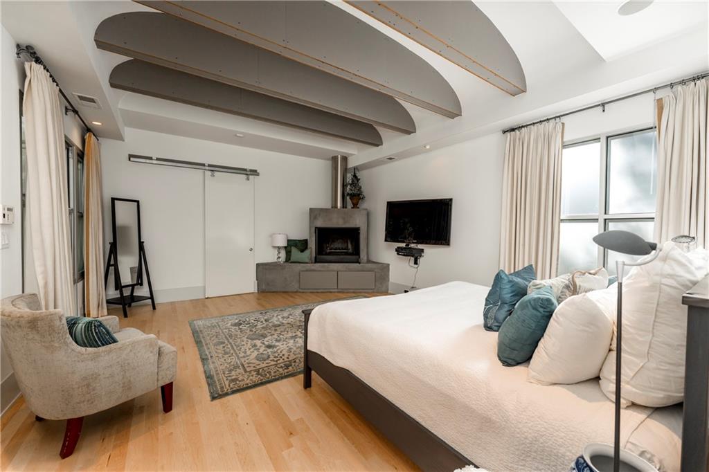 1775 Mt Paran Road Northwest Atlanta, GA 30327 - Photo 33 of 66 a bedroom with furniture and a flat screen tv