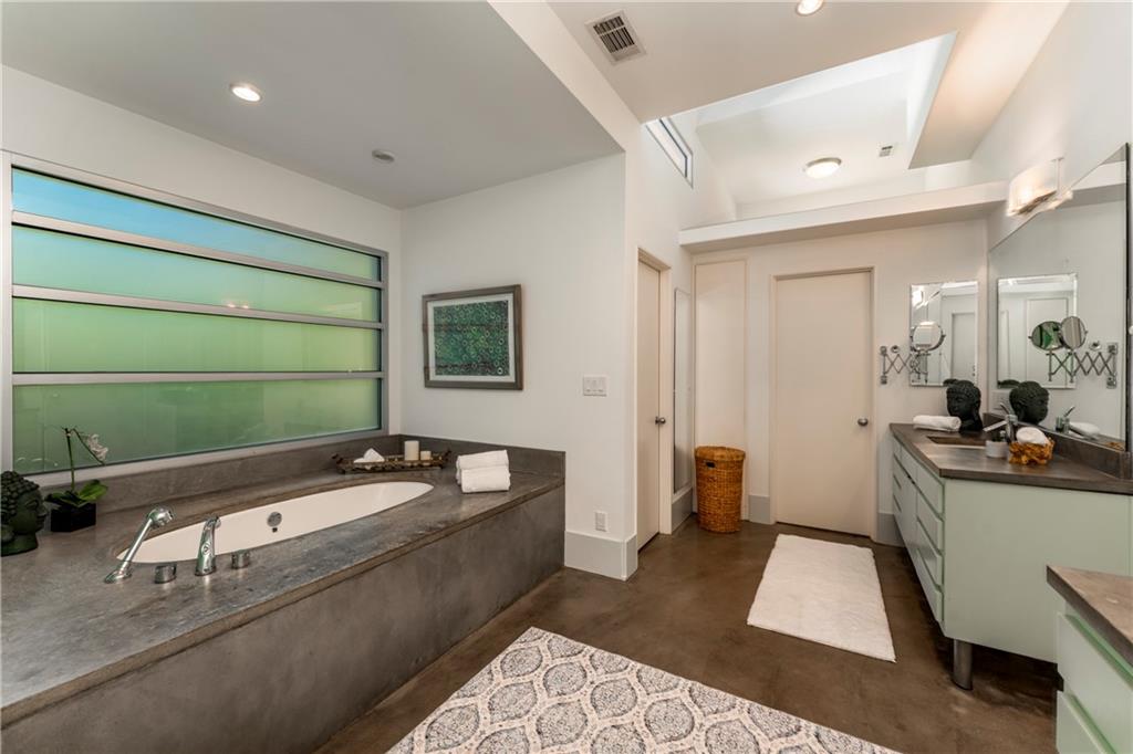 1775 Mt Paran Road Northwest Atlanta, GA 30327 - Photo 36 of 66 a bathroom with a tub sink and mirror