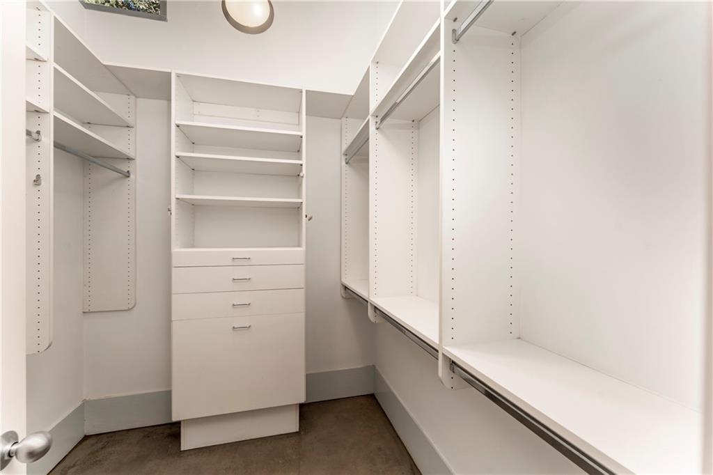 1775 Mt Paran Road Northwest Atlanta, GA 30327 - Photo 39 of 66 a view of walk in closet with empty racks