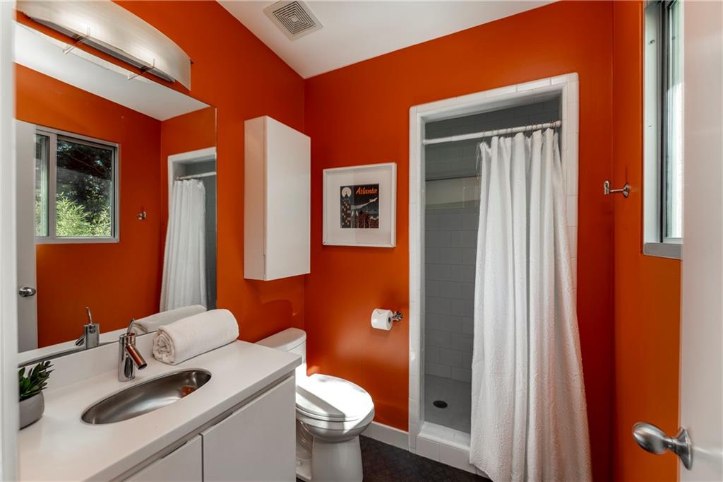 1775 Mt Paran Road Northwest Atlanta, GA 30327 - Photo 45 of 66 a bathroom with a sink toilet and shower