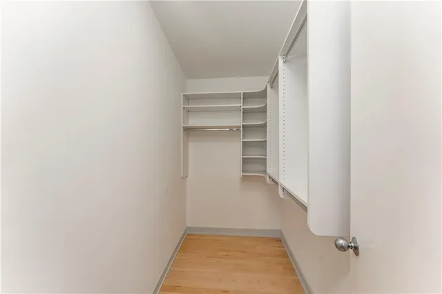 a living room filled with furniture and a floor to ceiling window