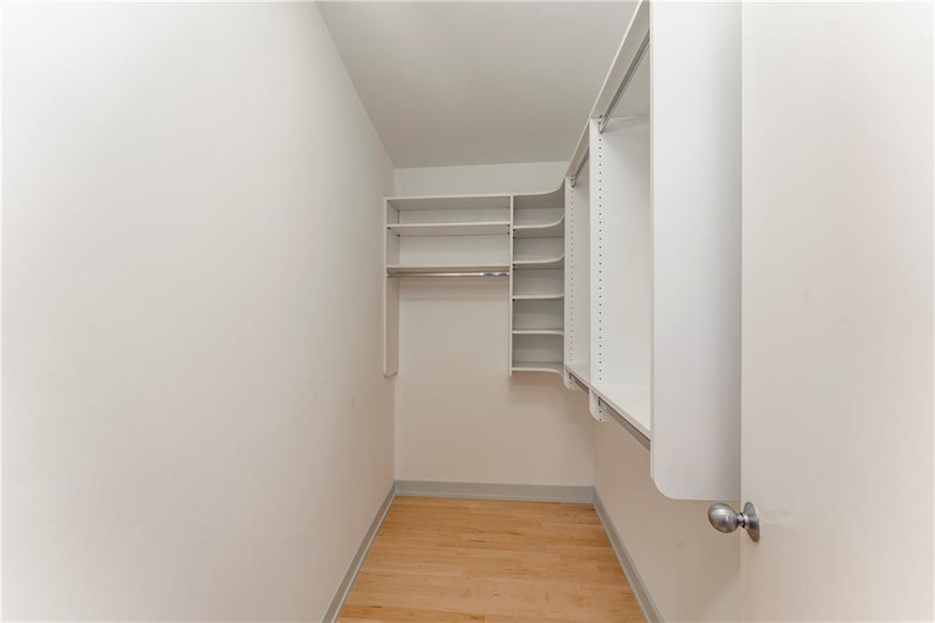 1775 Mt Paran Road Northwest Atlanta, GA 30327 - Photo 46 of 66 a view of walk in closet with empty racks
