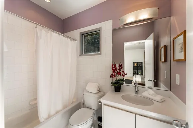 a front view of a house with a yard and a garage