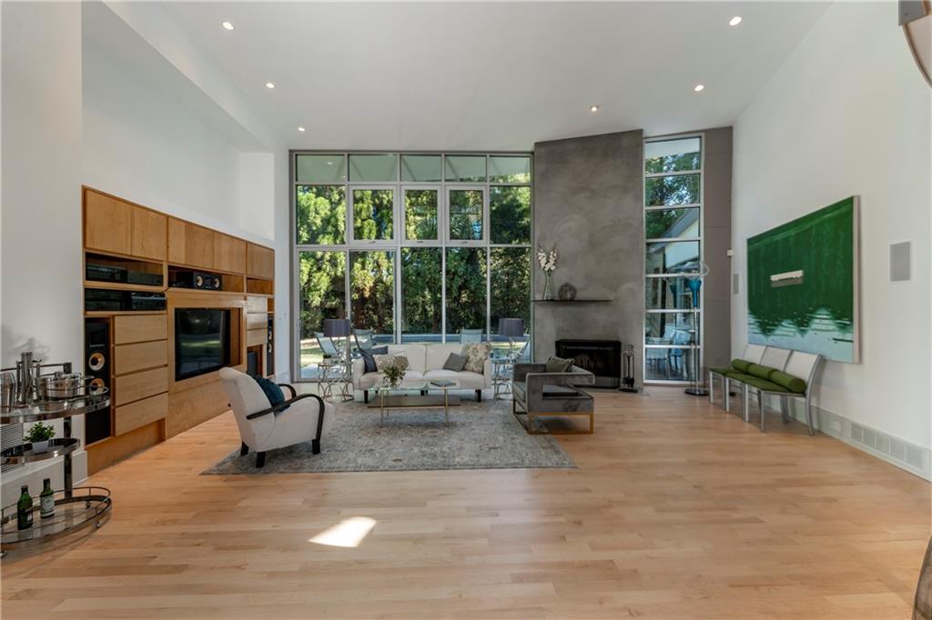 1775 Mt Paran Road Northwest Atlanta, GA 30327 - Photo 5 of 66 a living room with furniture large window and a fireplace