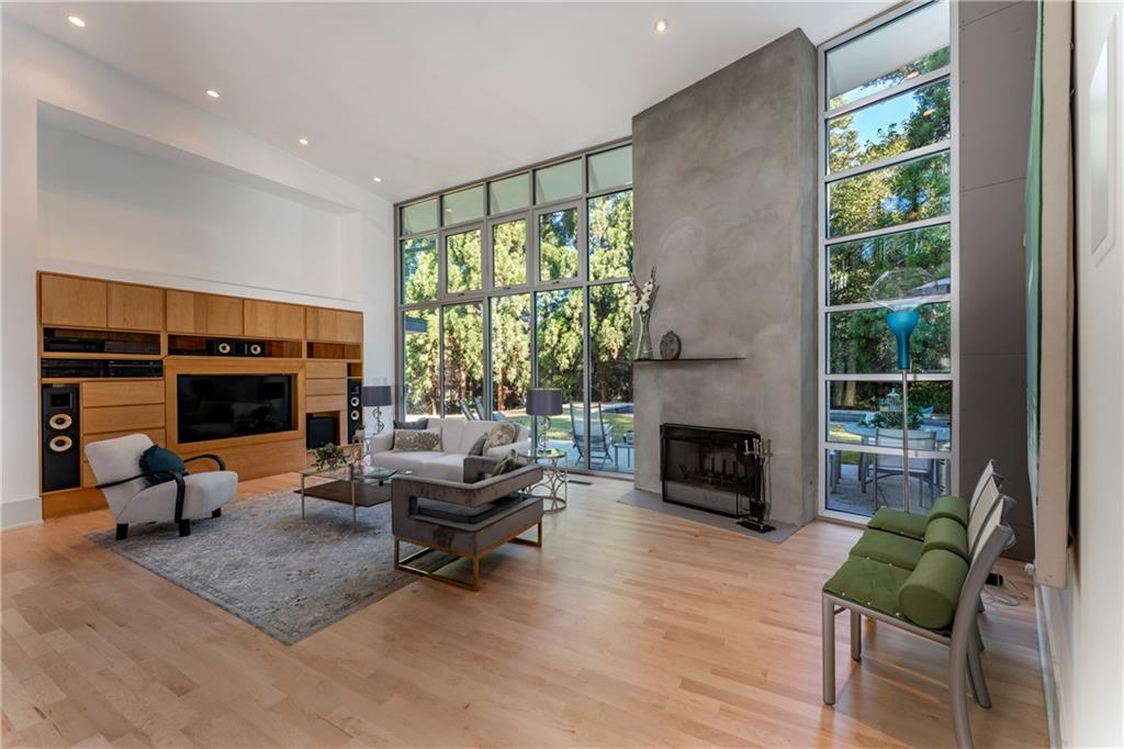 1775 Mt Paran Road Northwest Atlanta, GA 30327 - Photo 10 of 66 a living room with furniture fireplace and a large window