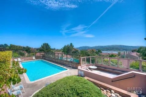 a view of a swimming pool with a lounge chair