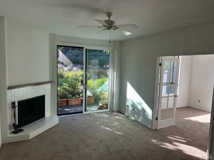 a view of a livingroom with furniture and a fireplace