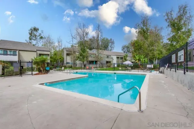 a view of swimming pool with outdoor seating