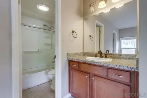 a bathroom with a shower and a toilet