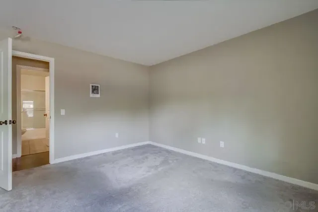 a bathroom with a shower and a toilet