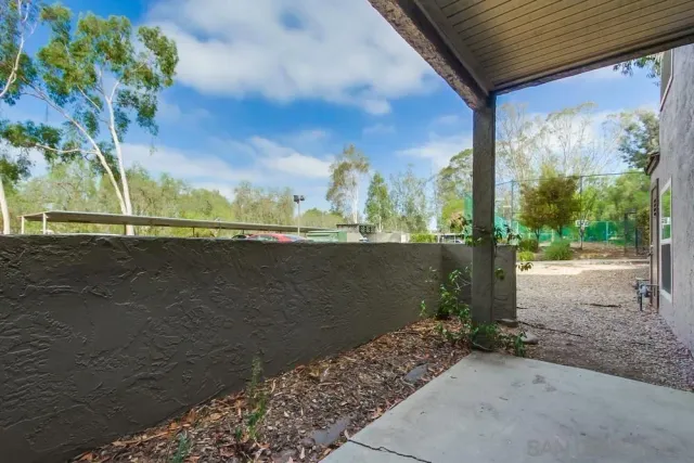 a view of a house with a backyard and a garden