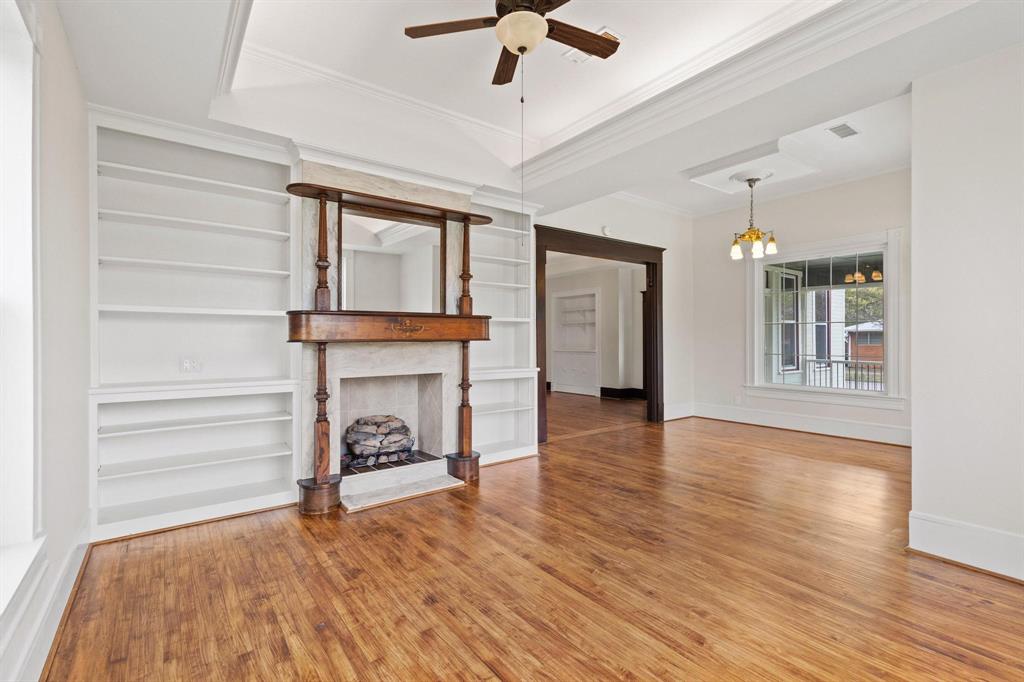 1001 West Morton Street Denison, TX 75020 - Photo 11 of 37 a view of an empty room with window and wooden floor