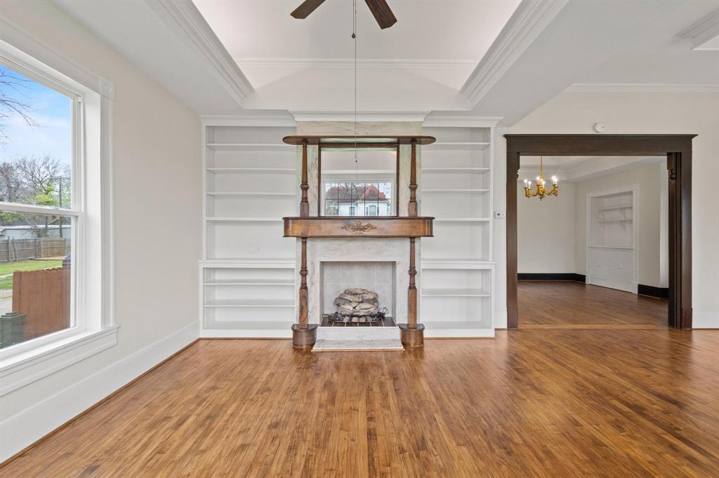 1001 West Morton Street Denison, TX 75020 - Photo 12 of 37 a view of an empty room window and wooden floor