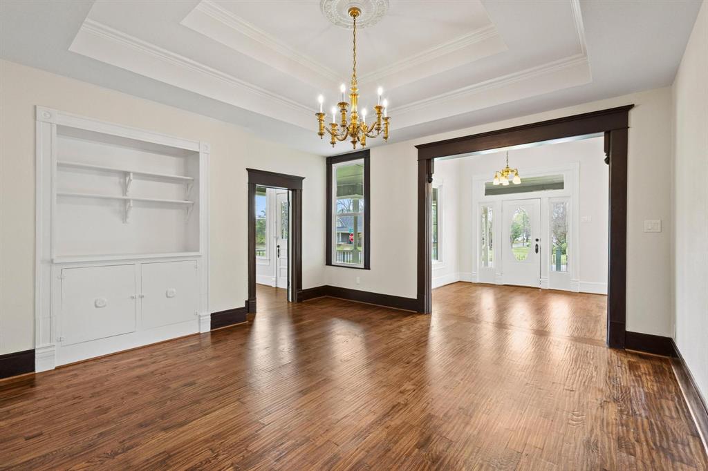 1001 West Morton Street Denison, TX 75020 - Photo 16 of 37 a view of an empty room with window and wooden floor