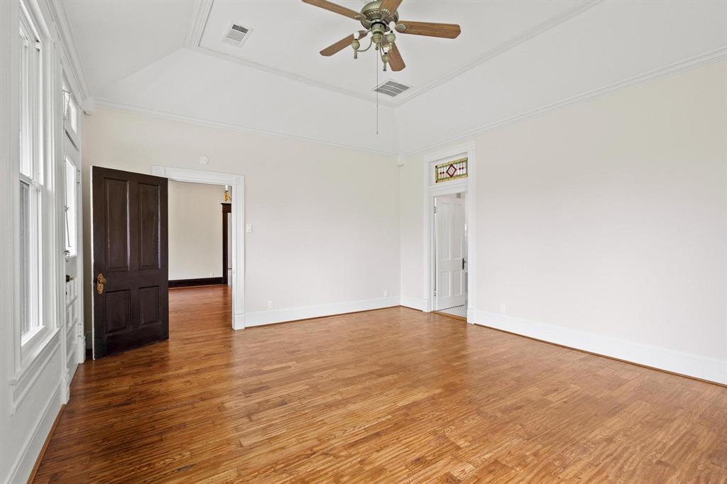 1001 West Morton Street Denison, TX 75020 - Photo 21 of 37 a view of an empty room with wooden floor