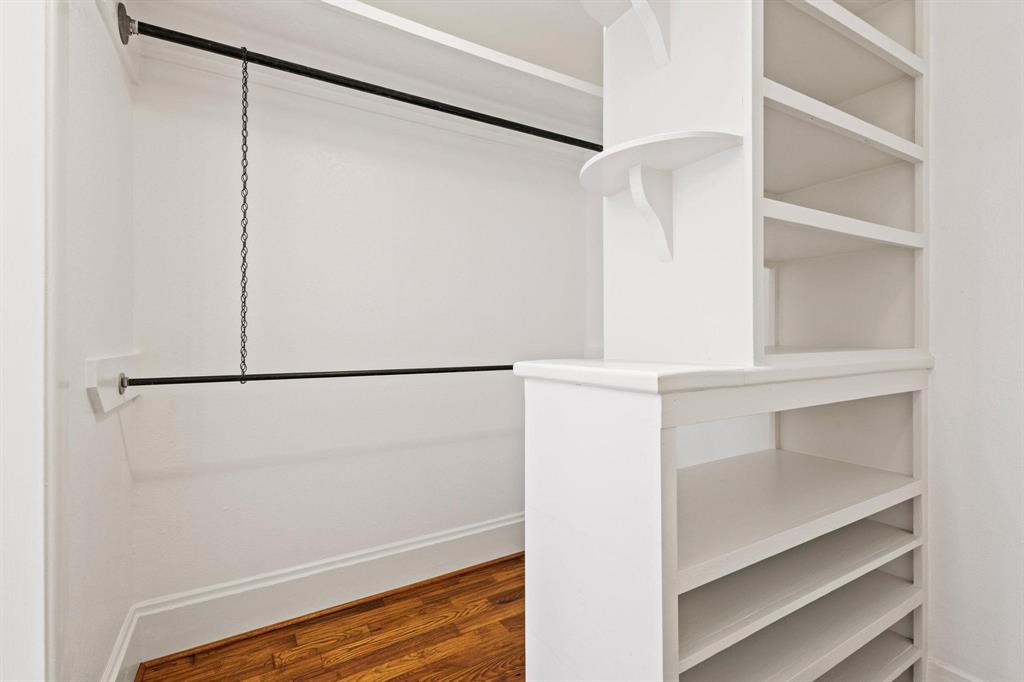 1001 West Morton Street Denison, TX 75020 - Photo 26 of 37 a view of walk in closet with empty racks