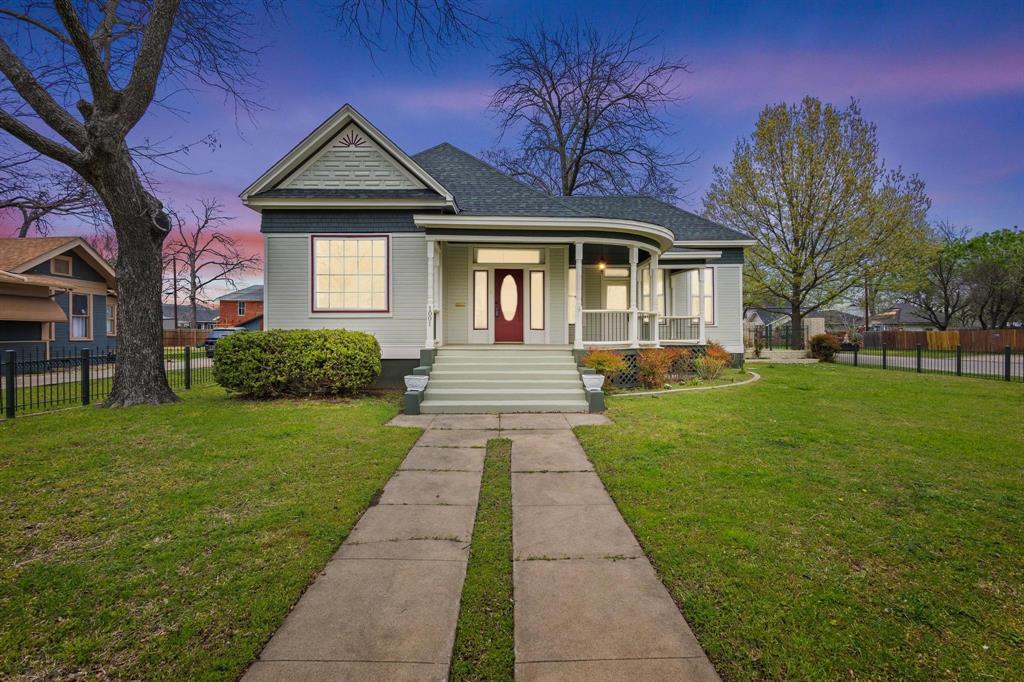 1001 West Morton Street Denison, TX 75020 - Photo 3 of 37 a front view of a house with a yard