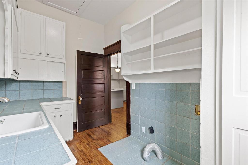 1001 West Morton Street Denison, TX 75020 - Photo 33 of 37 a bathroom with a bathtub and a shower