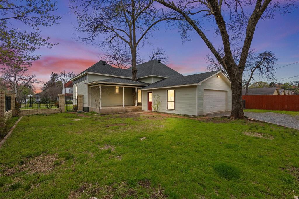 1001 West Morton Street Denison, TX 75020 - Photo 34 of 37 a front view of a house with a garden