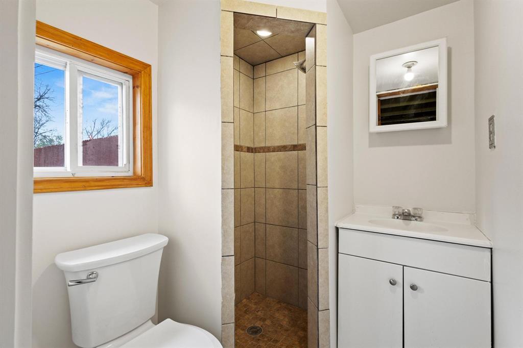 1001 West Morton Street Denison, TX 75020 - Photo 37 of 37 a bathroom with a sink toilet and shower