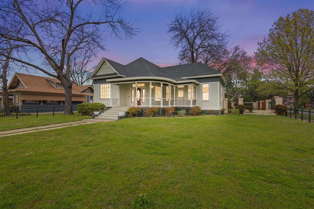 1001 West Morton Street Denison, TX 75020 - Photo 5 of 37 a front view of a house with a garden