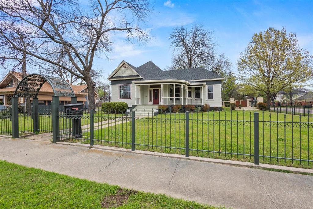 1001 West Morton Street Denison, TX 75020 - Photo 6 of 37 a front view of a house with a garden and plants