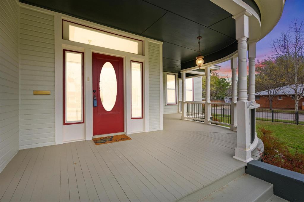 1001 West Morton Street Denison, TX 75020 - Photo 7 of 37 a view of a room with wooden floor and iron stairs