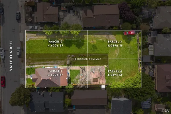 an outdoor space with a table and chairs