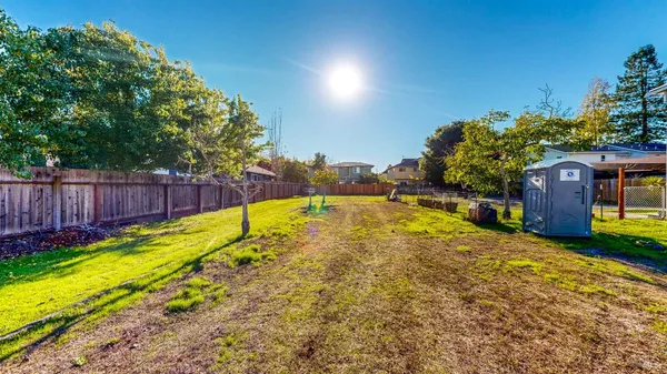 a view of swimming pool with a backyard