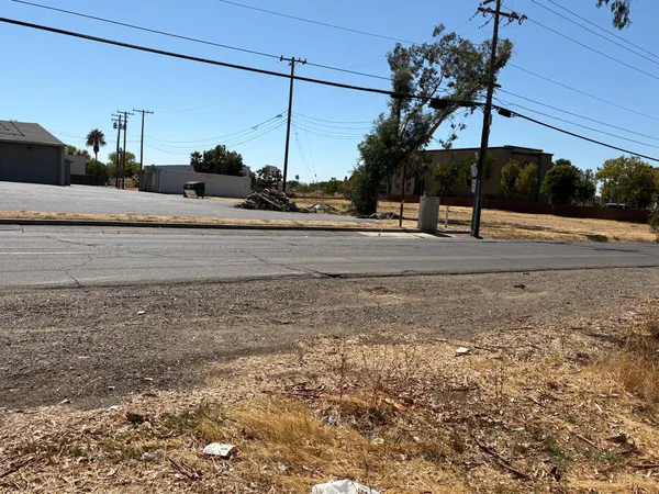 a view of a street with a building in the background