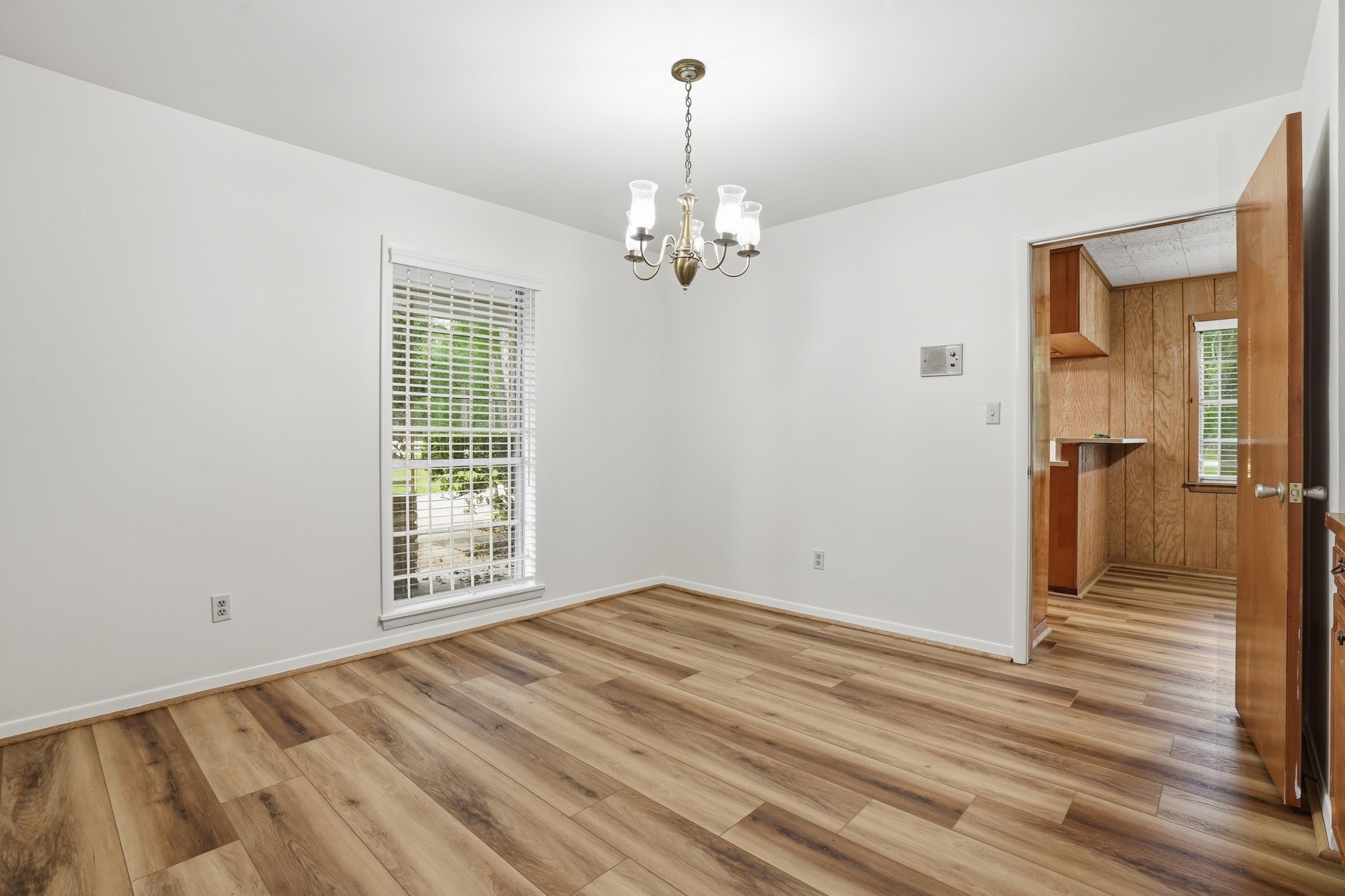 10240 Post Oak Drive Conroe, TX 77385 - Photo 13 of 46 wooden floor in an empty room with a window