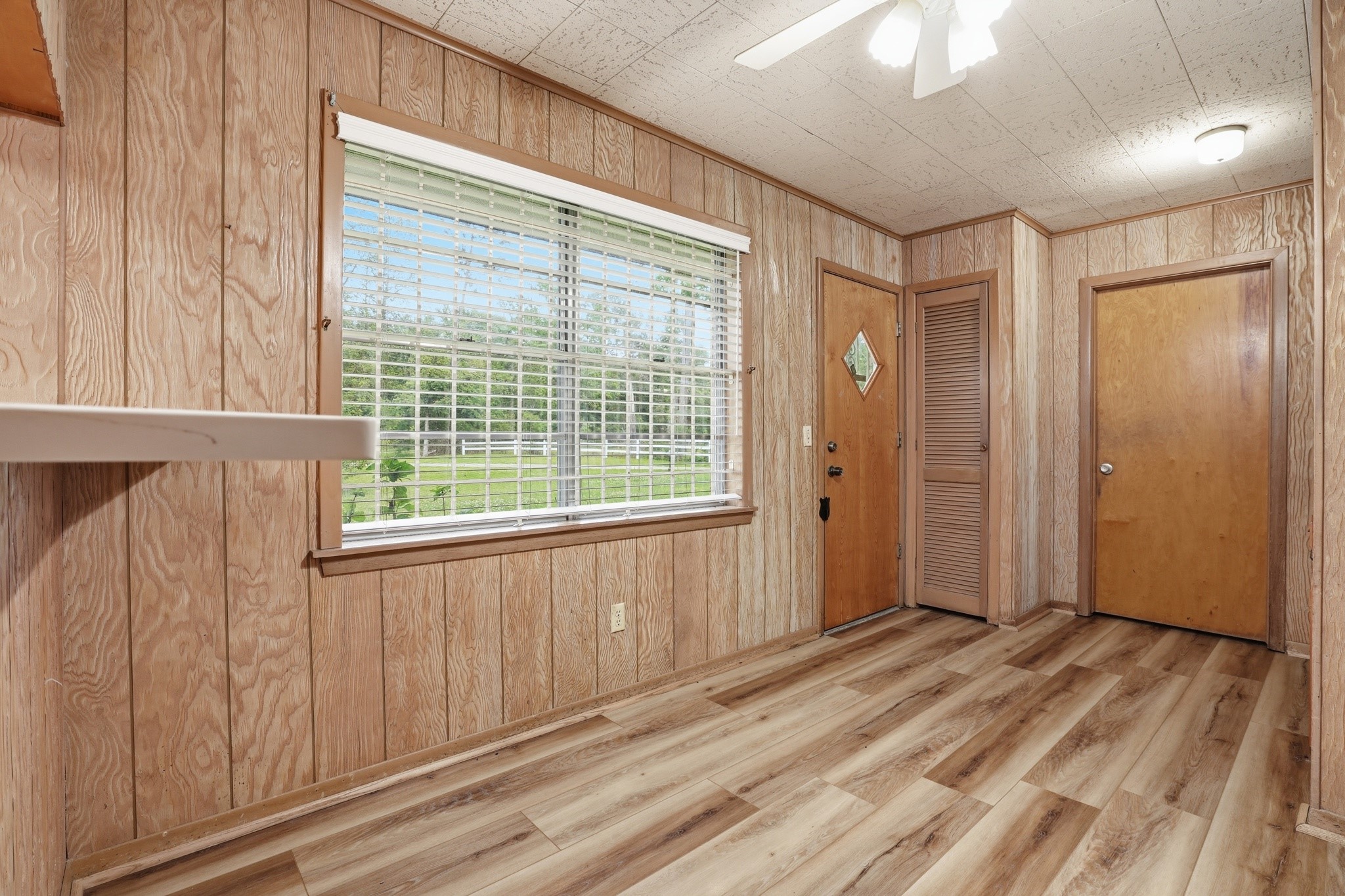 10240 Post Oak Drive Conroe, TX 77385 - Photo 16 of 46 a view of a hallway with wooden floor and staircase