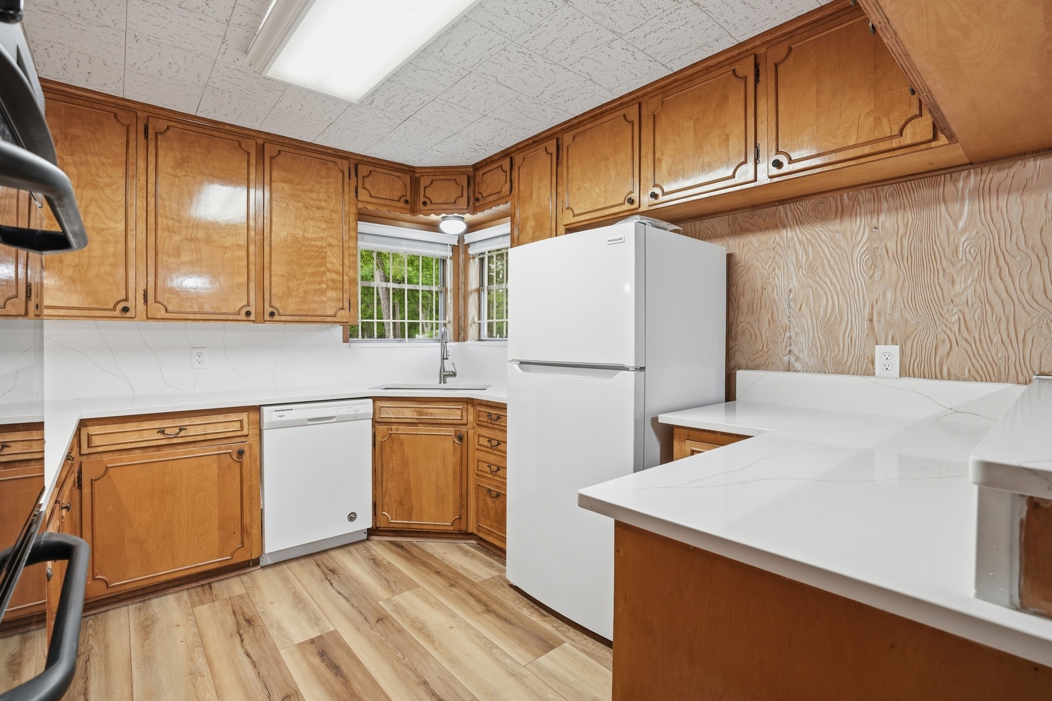 10240 Post Oak Drive Conroe, TX 77385 - Photo 17 of 46 a kitchen with stainless steel appliances granite countertop wooden cabinets a refrigerator and a sink